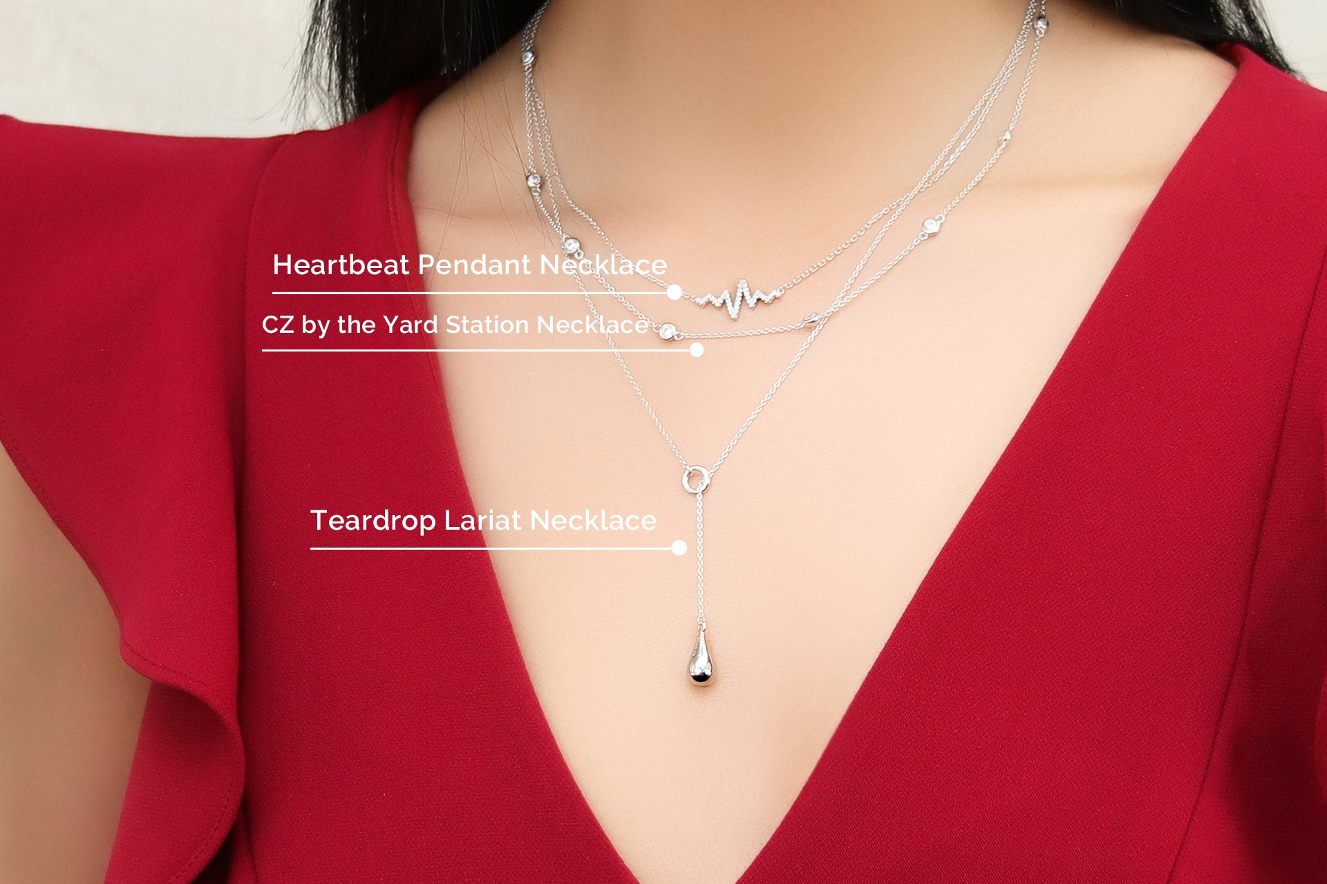 Model wearing layered layered necklaces