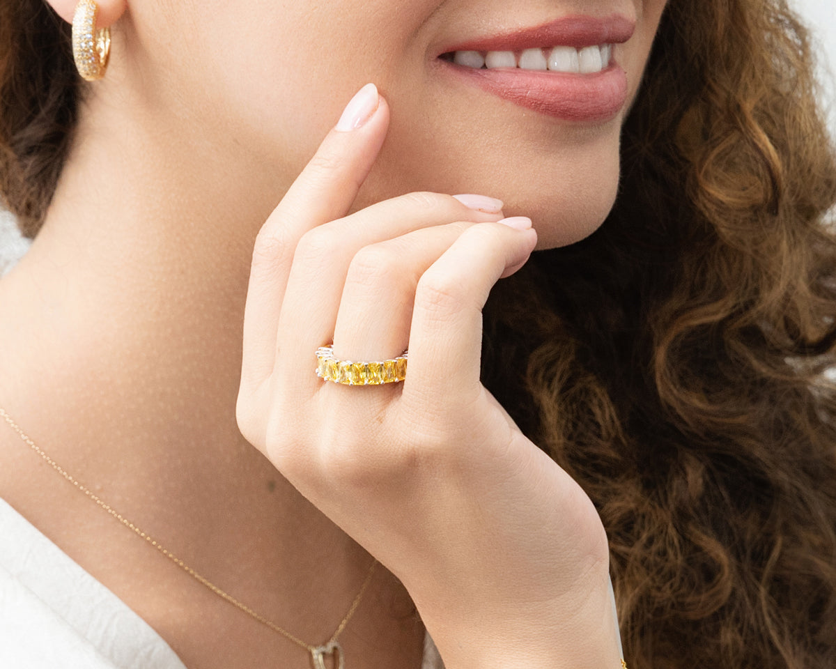 Model wearing a canary yellow eternity band.
