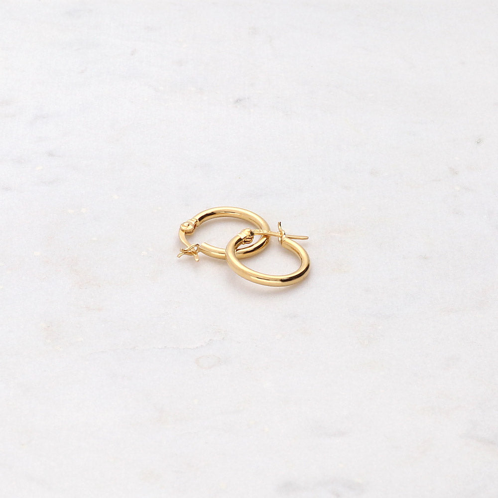 Flatlay view of Small Hoop Earrings in Sterling Silver 0.6 inch, Yellow Gold Flashed