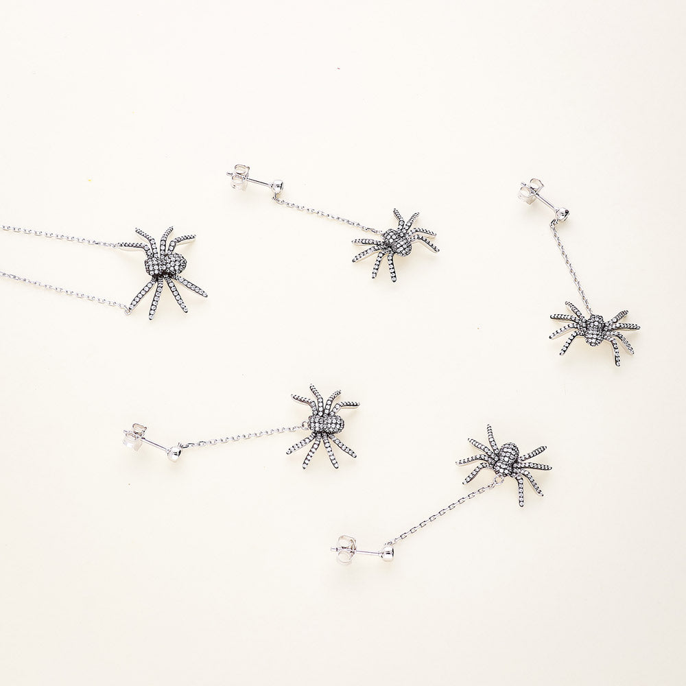Flatlay view of Spider CZ Dangle Earrings in Sterling Silver