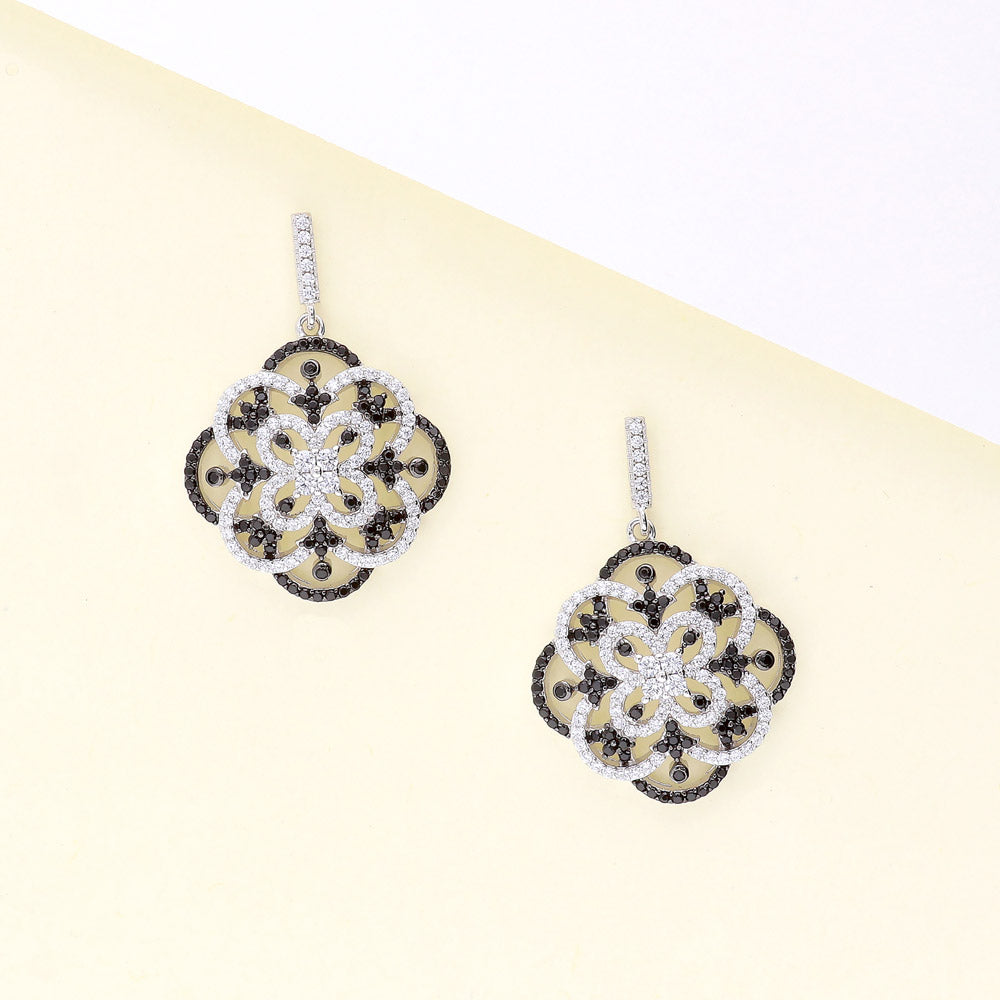 Flatlay view of Flower Black and White CZ Statement Dangle Earrings in Sterling Silver