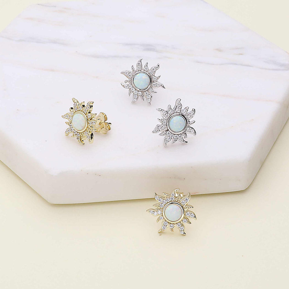 Flatlay view of Halo Sun Simulated Opal Round CZ Set in Gold Flashed Sterling Silver