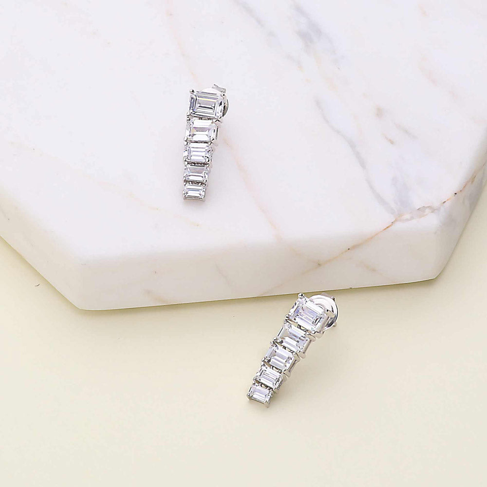 Flatlay view of 5-Stone Graduated CZ Dangle Earrings in Sterling Silver