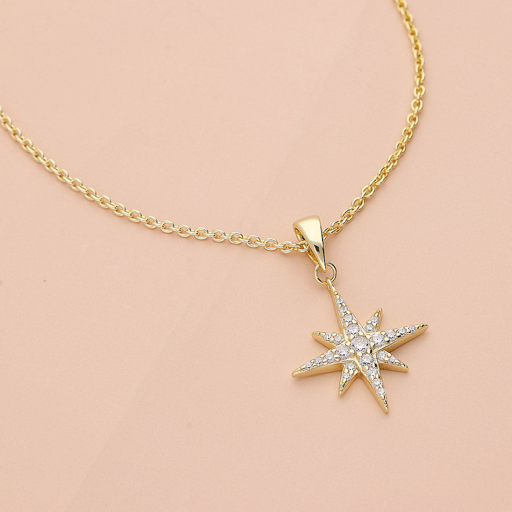 Flatlay view of North Star CZ Necklace in Sterling Silver, Yellow Gold Flashed