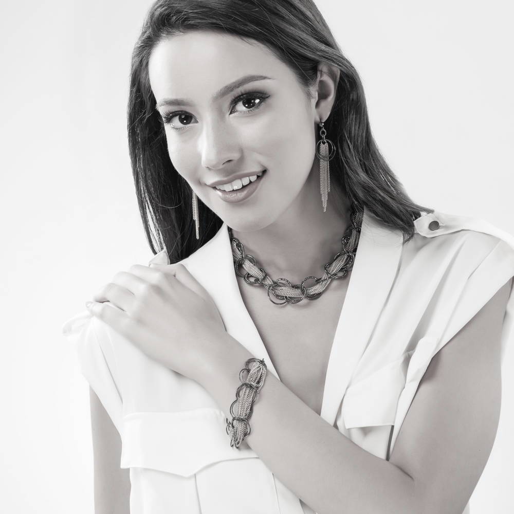 Model wearing Open Circle Statement Necklace, Black And Rose Gold-Tone