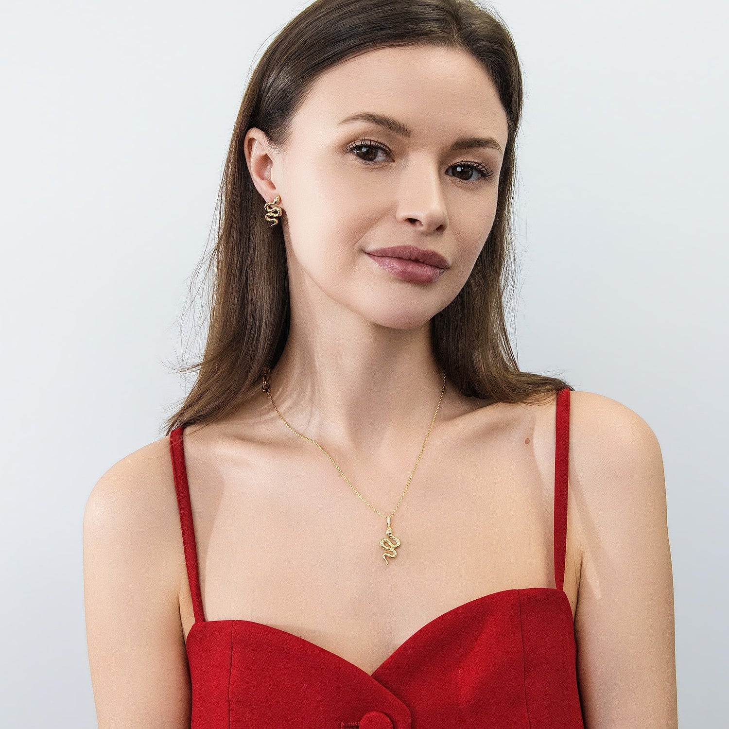 Model wearing Snake CZ Stud Earrings in Sterling Silver, Gold Flashed