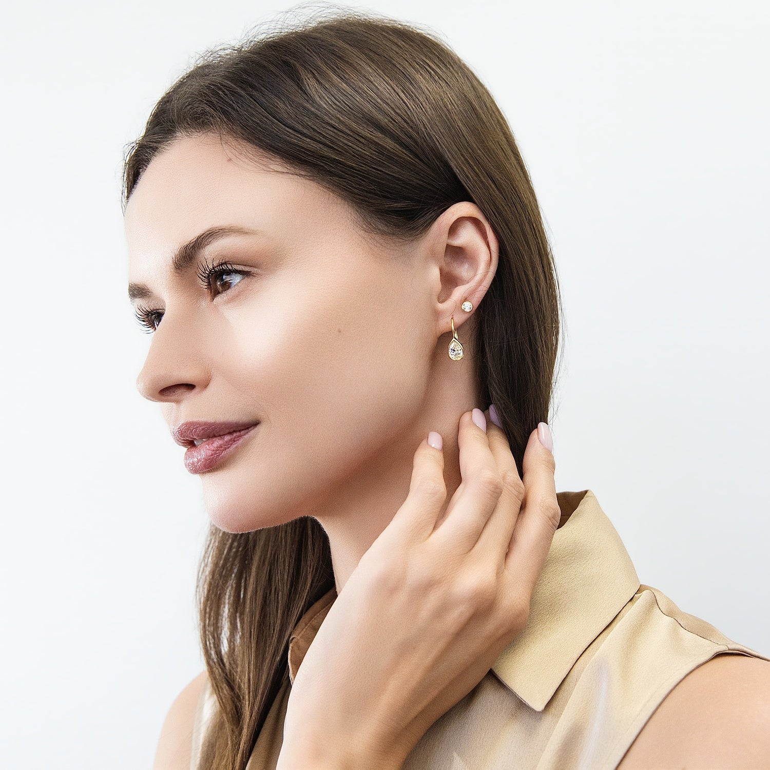 Model wearing Martini Solitaire Bezel CZ Stud Earrings, Gold Flashed, Clear / 4mm