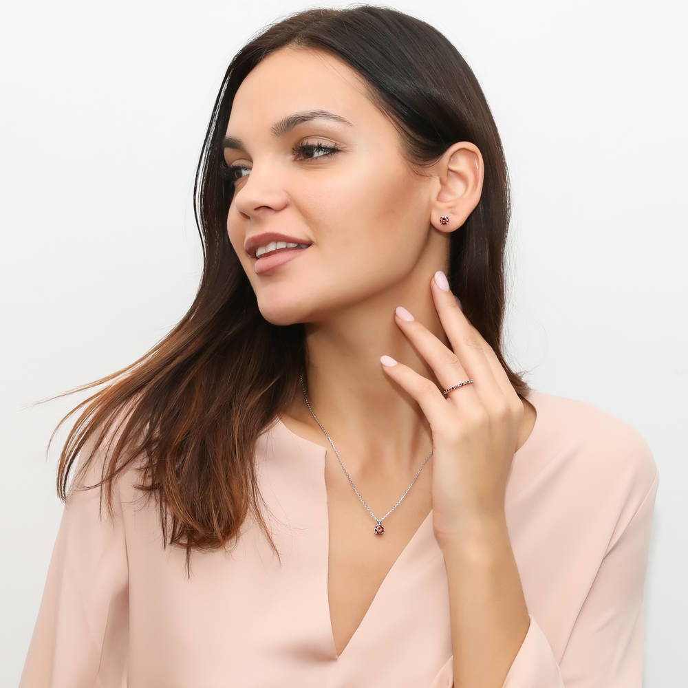 Model wearing Solitaire CZ Necklace in Sterling Silver, Round Cut / Caramel