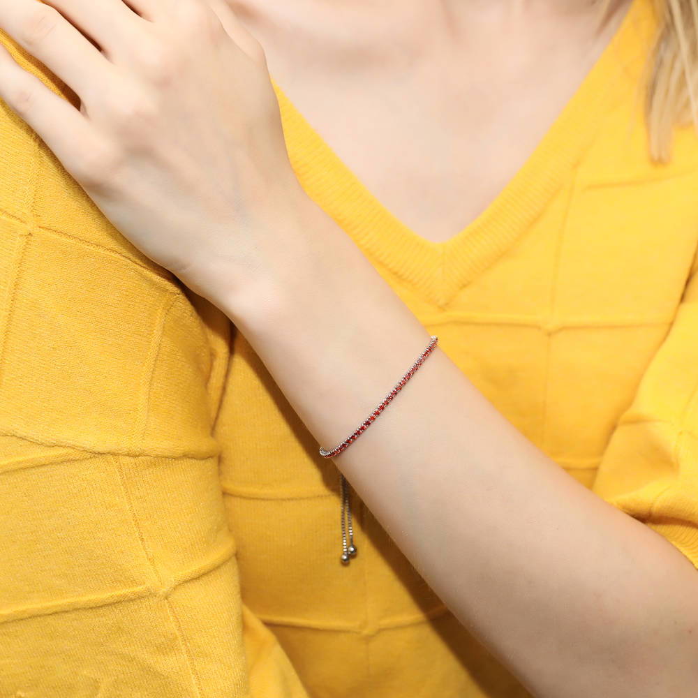 Model wearing CZ Tennis Bracelet Gold Flashed, Red Color