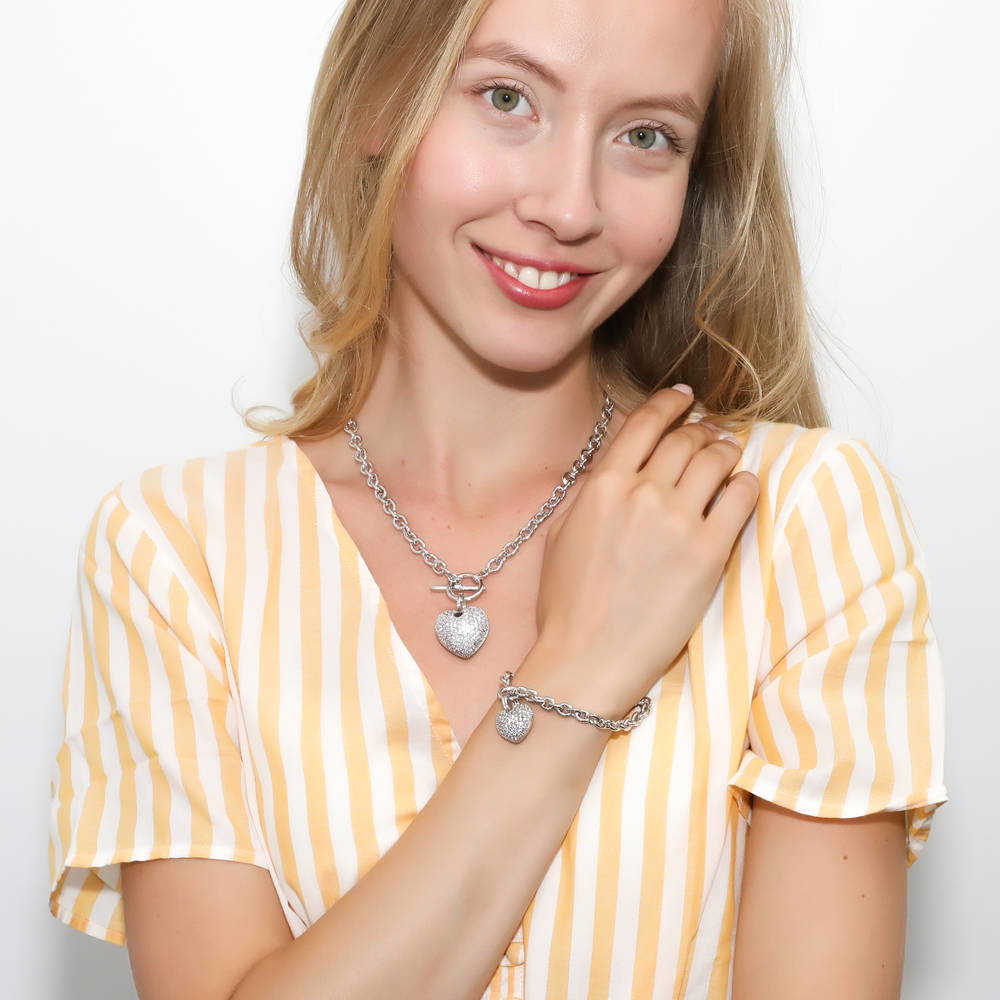 Model wearing Heart CZ Toggle Necklace, Silver-Tone / 18 Inch