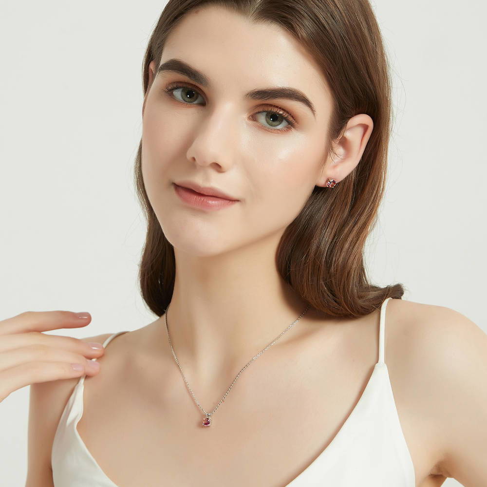 Model wearing Kaleidoscope Solitaire 0.8ct CZ Necklace in Sterling Silver, Red Orange Color