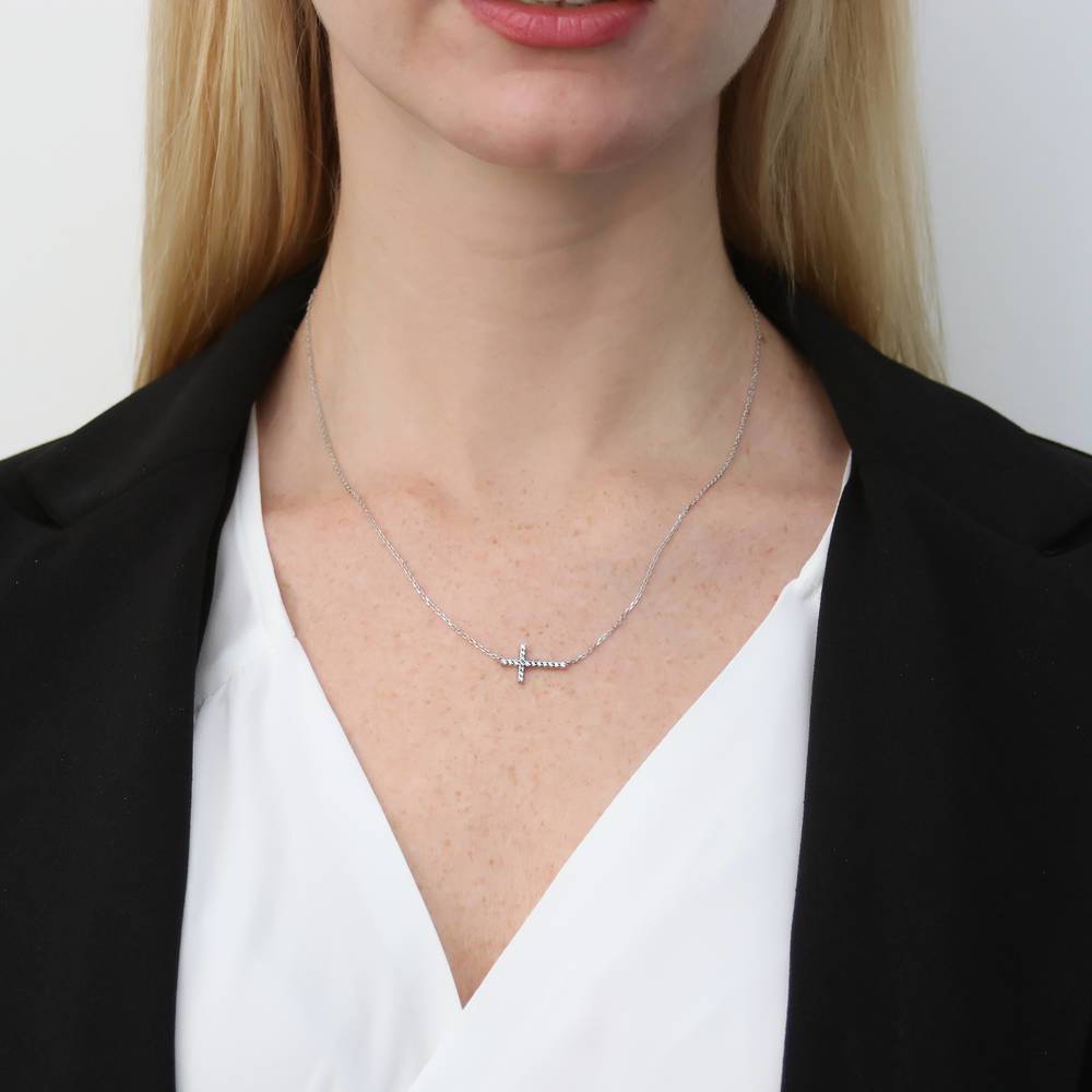 Model wearing Sideways Cross CZ Necklace in Sterling Silver, Rhodium Plated