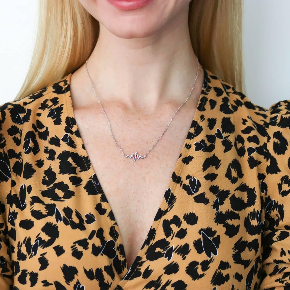 Model wearing Heartbeat CZ Necklace in Sterling Silver, Yellow Gold Flashed