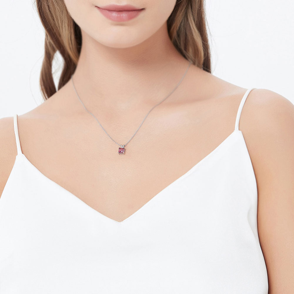 Model wearing Solitaire CZ Necklace in Sterling Silver, Princess Cut / Red