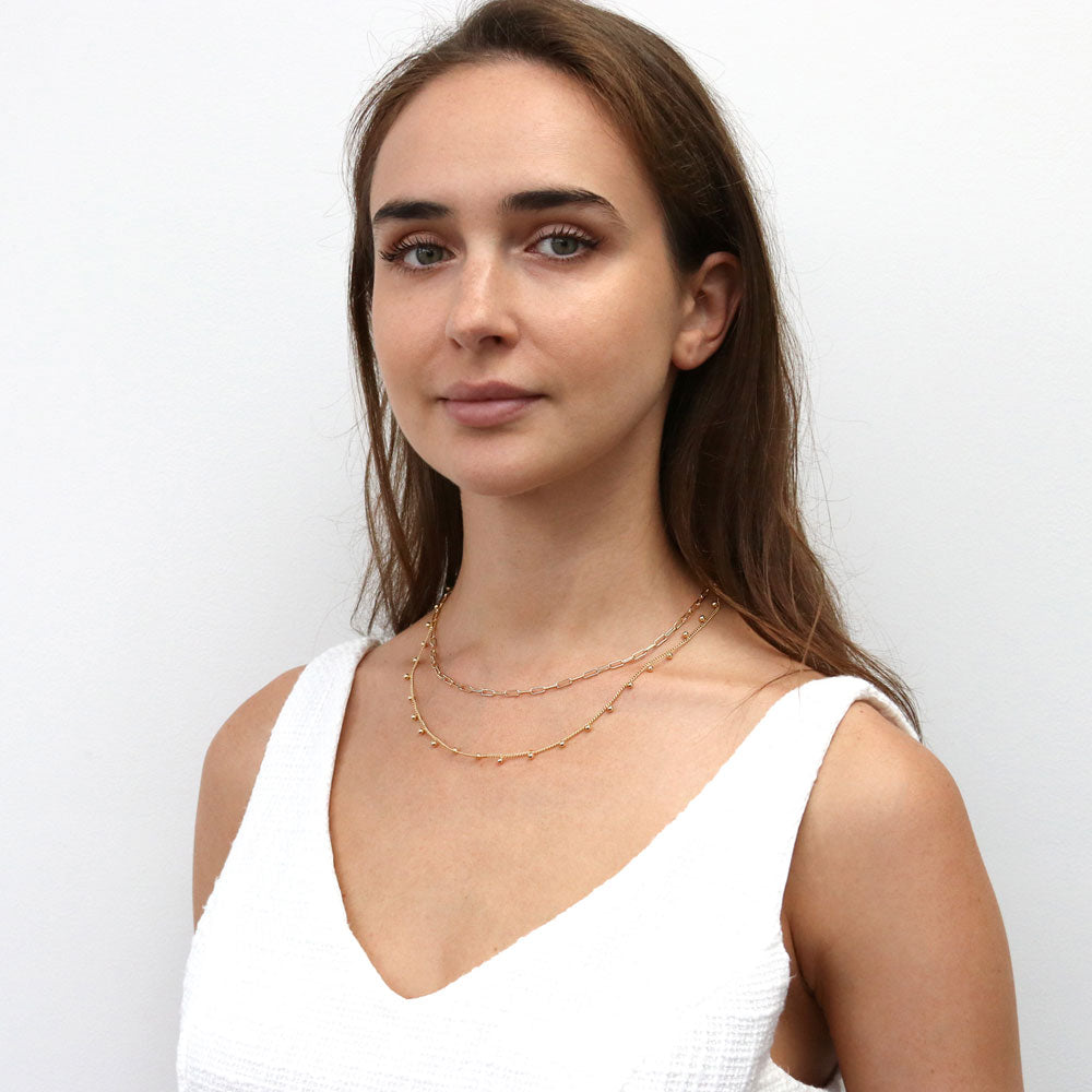 Model wearing Bead Station Necklace, Rose Gold Plated