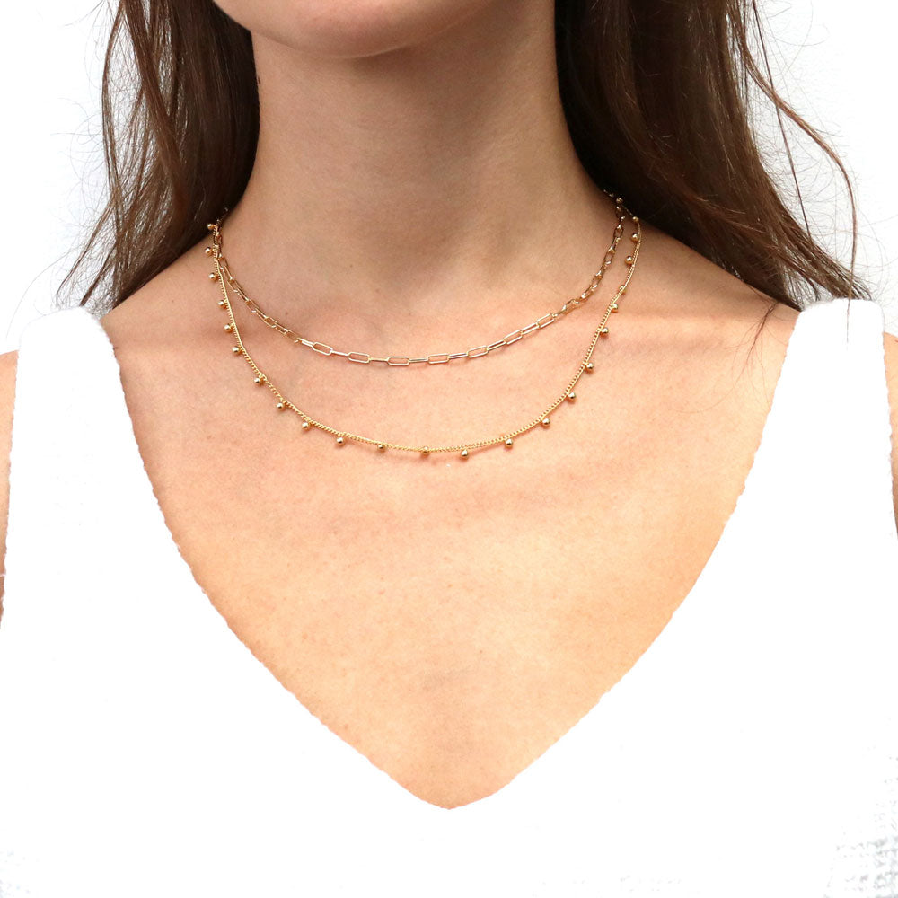 Model wearing Bead Station Necklace, Rose Gold Plated