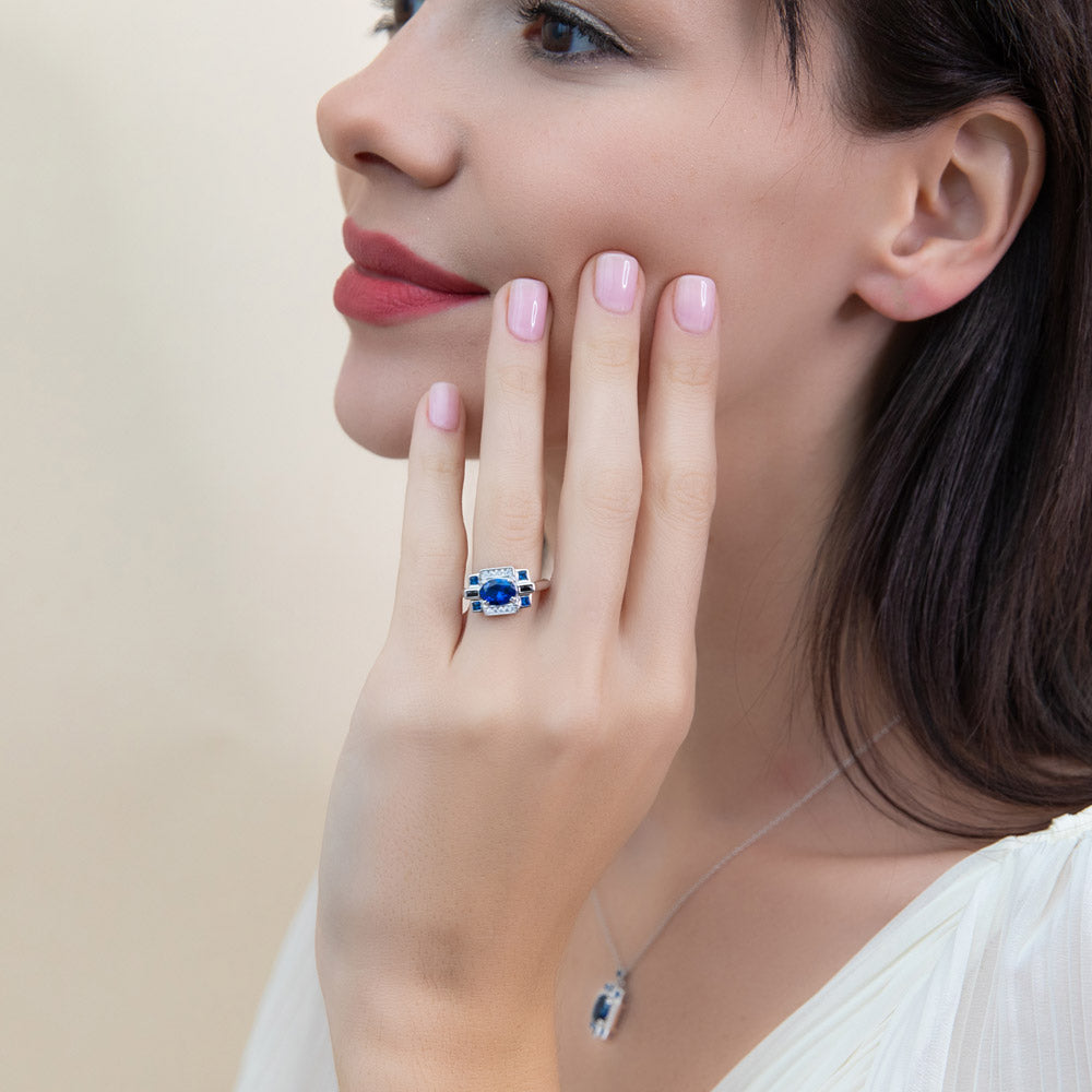 Model wearing Art Deco Simulated Blue Sapphire CZ Ring in Sterling Silver