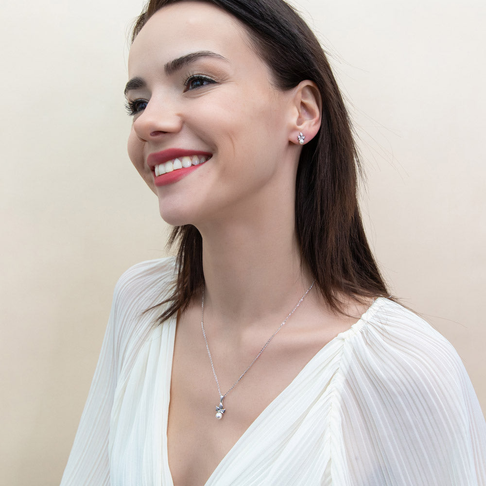 Model wearing Leaf Imitation Pearl Stud Earrings in Sterling Silver, Rhodium Plated
