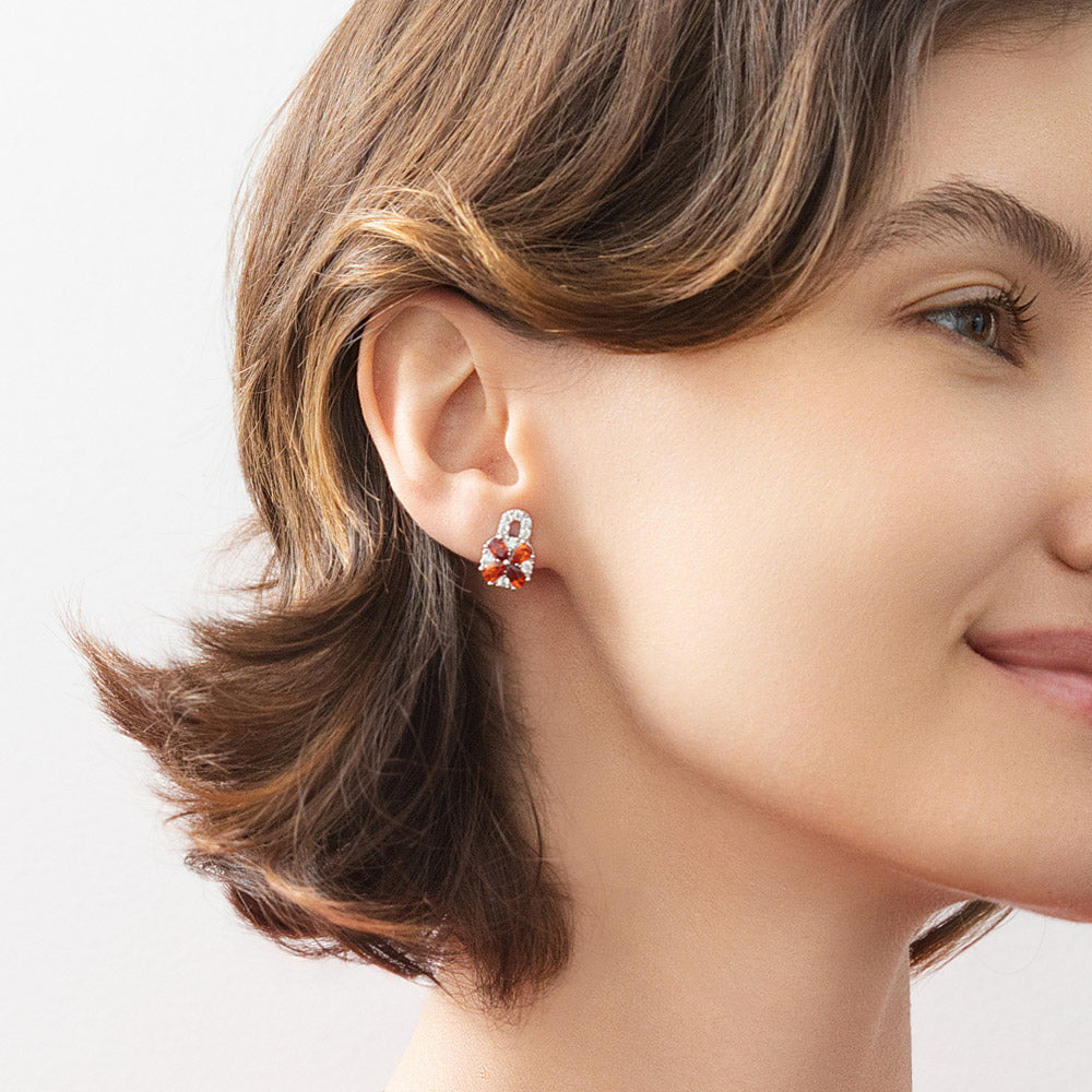 Model wearing Key and Lock CZ Stud Earrings in Sterling Silver, Red Color