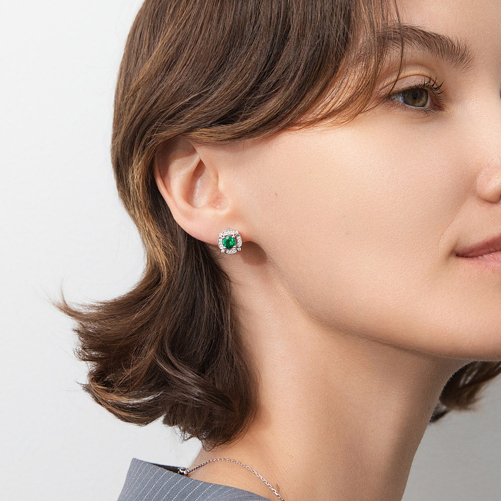 Model wearing Flower Halo CZ Stud Earrings in Sterling Silver, Emerald Color