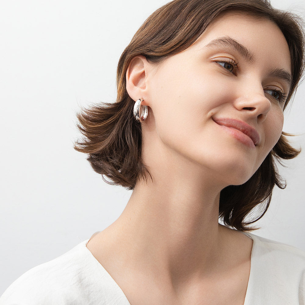 Model wearing Dome Small Hoop Earrings in Sterling Silver 0.8-1 inch, 2 Pairs, Rhodium Plated