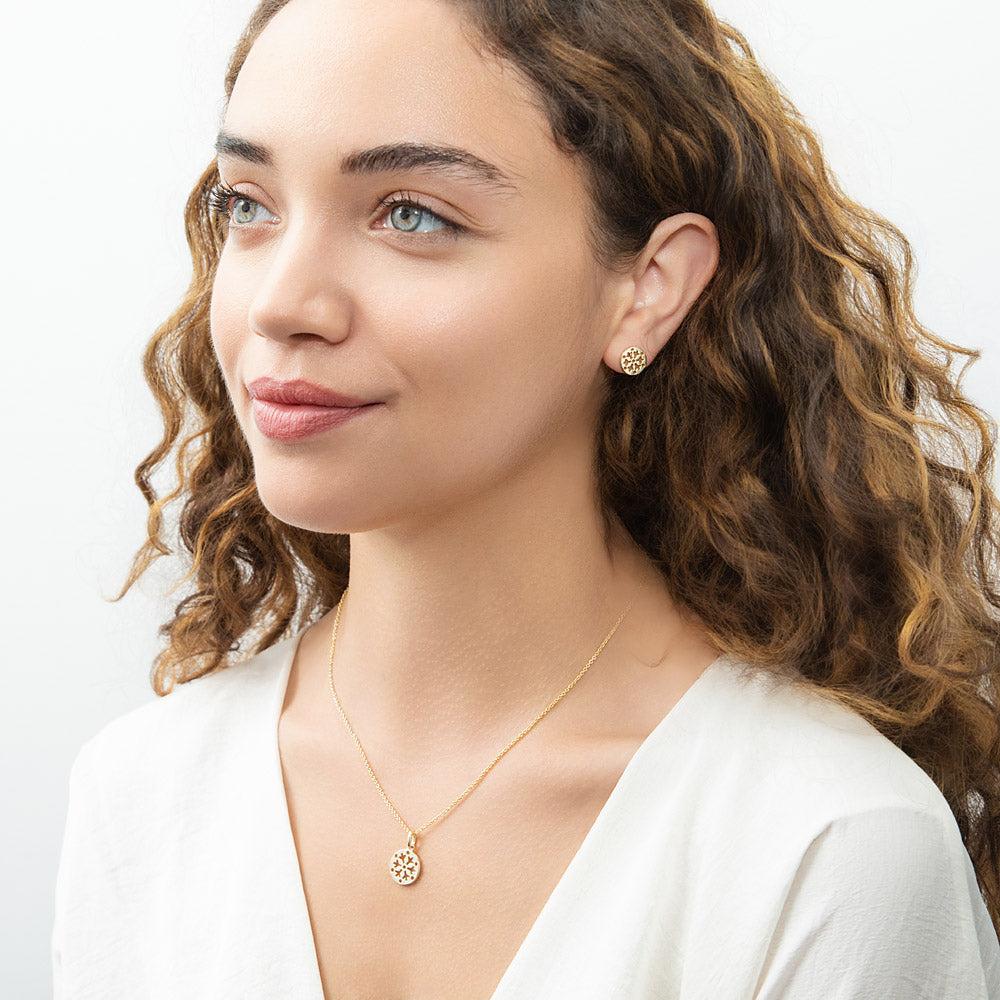 Model wearing Snowflake Coin Necklace in Sterling Silver, Yellow Gold Flashed