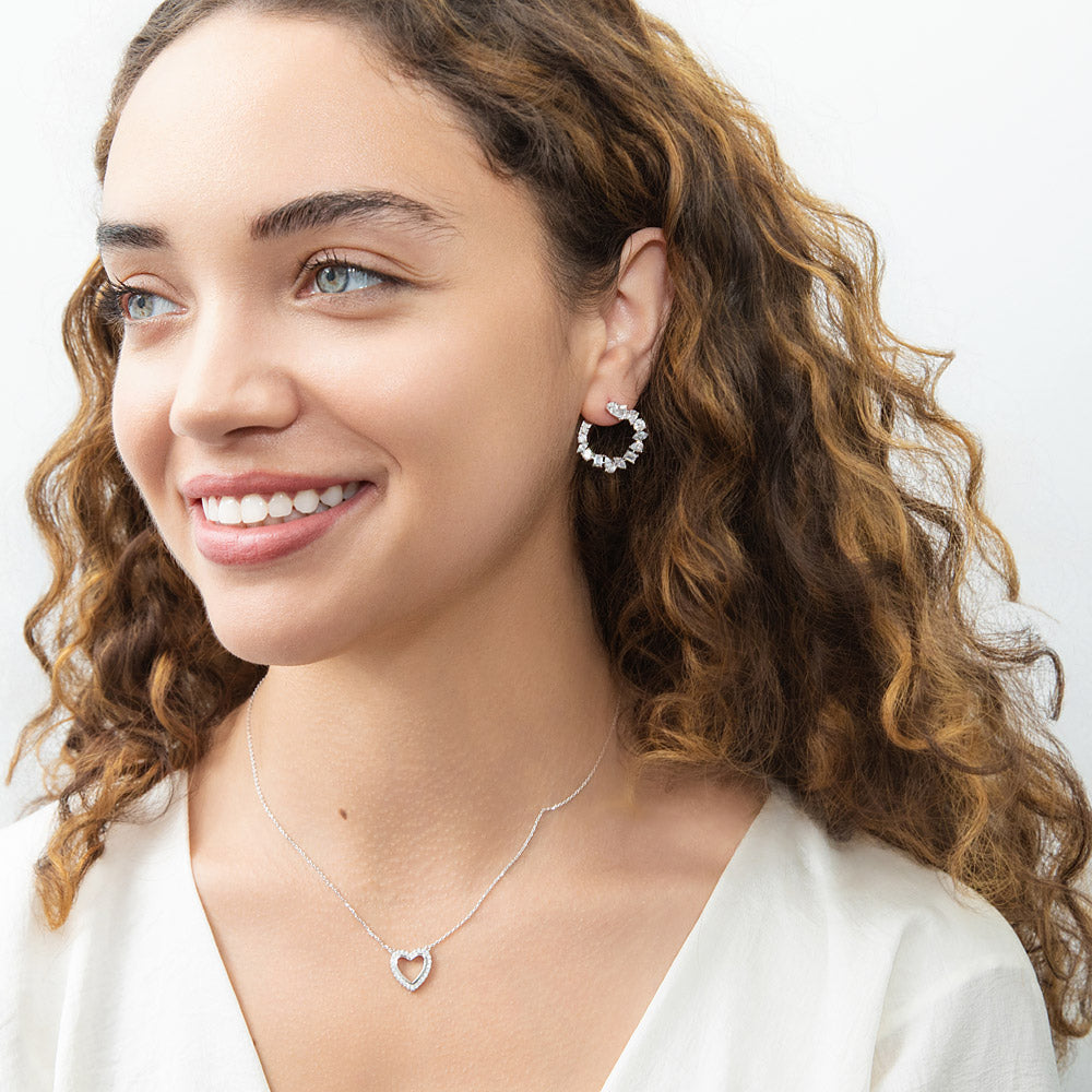 Model Wearing Cluster Hoop Earrings, Open Heart Pendant Necklace