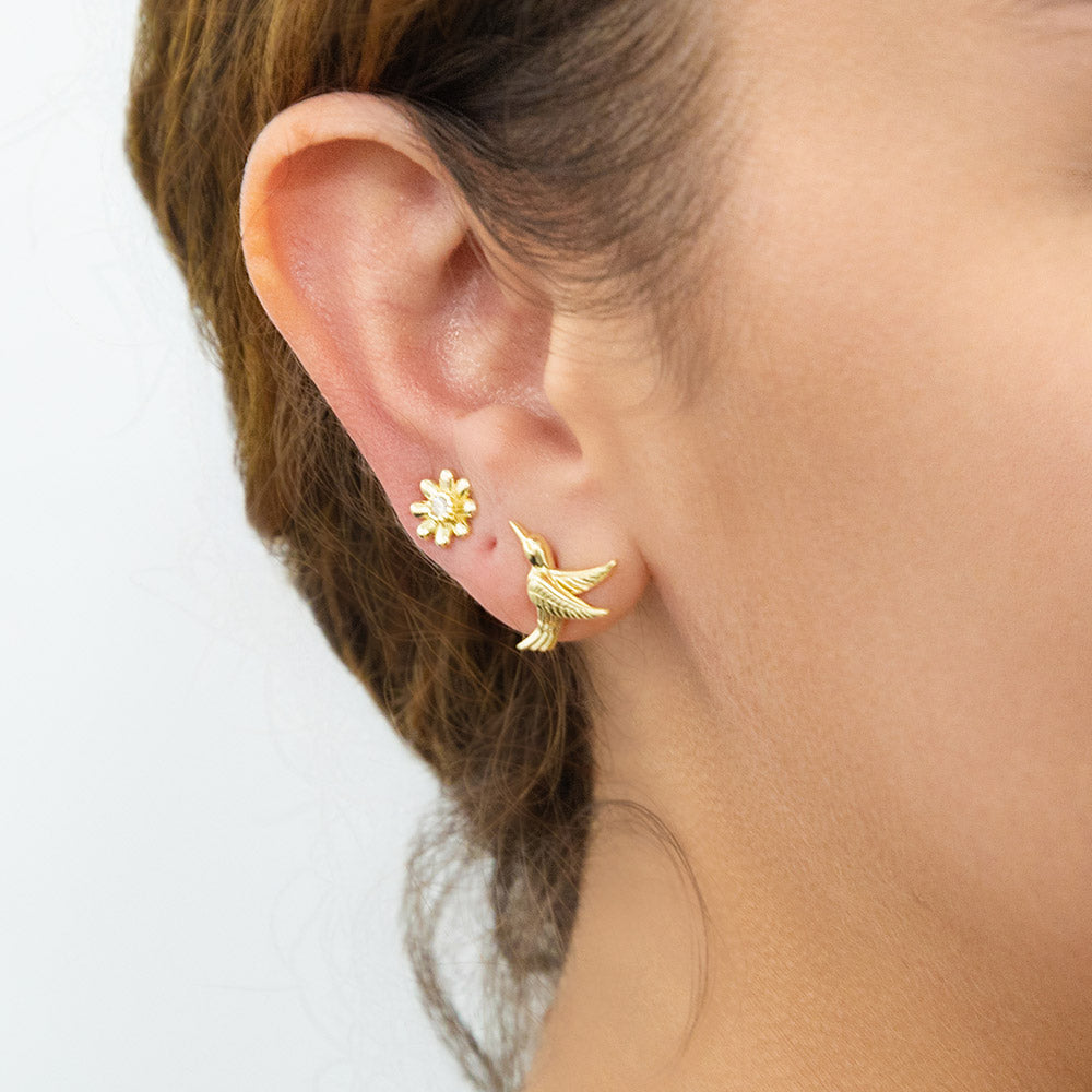 Model wearing Hummingbird Flower CZ Stud Earrings in Sterling Silver, Gold Flashed