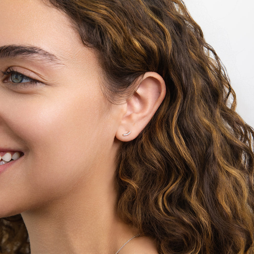 Model wearing Bar CZ Stud Earrings in Sterling Silver, Yellow Gold Flashed