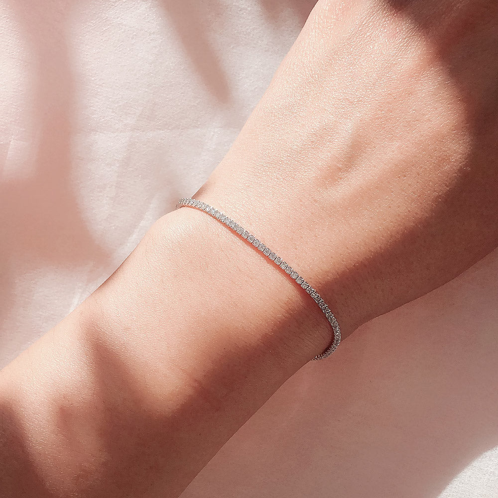 Model wearing CZ Tennis Bracelet in Sterling Silver, Yellow Gold Flashed, Black