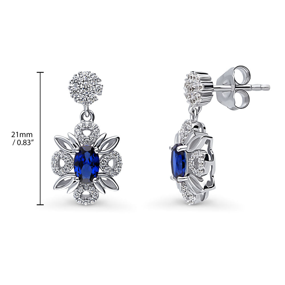 Front view of Flower Halo Simulated Blue Sapphire CZ Earrings in Sterling Silver