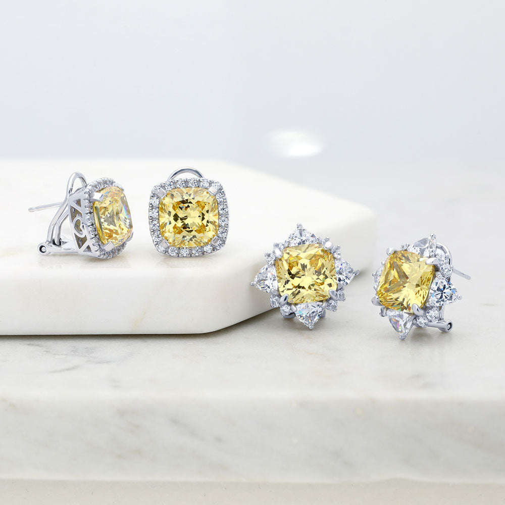Flatlay view of Halo Canary Cushion CZ Omega Back Stud Earrings in Sterling Silver