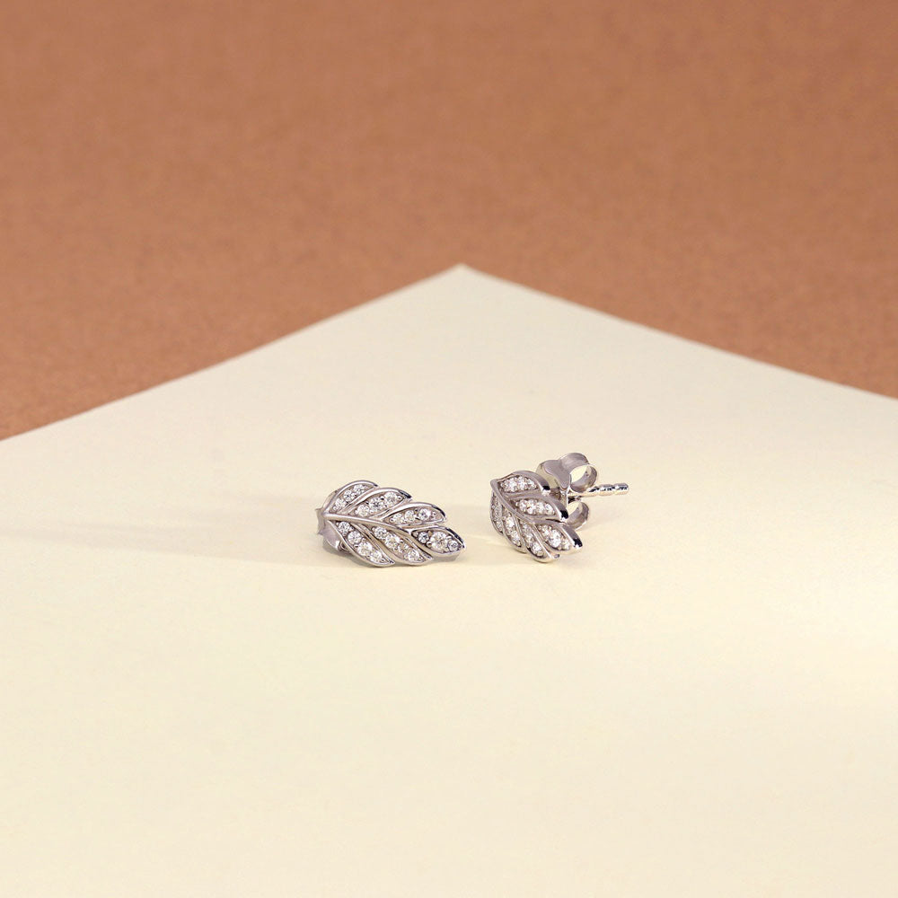 Flatlay view of Leaf CZ Stud Earrings in Sterling Silver