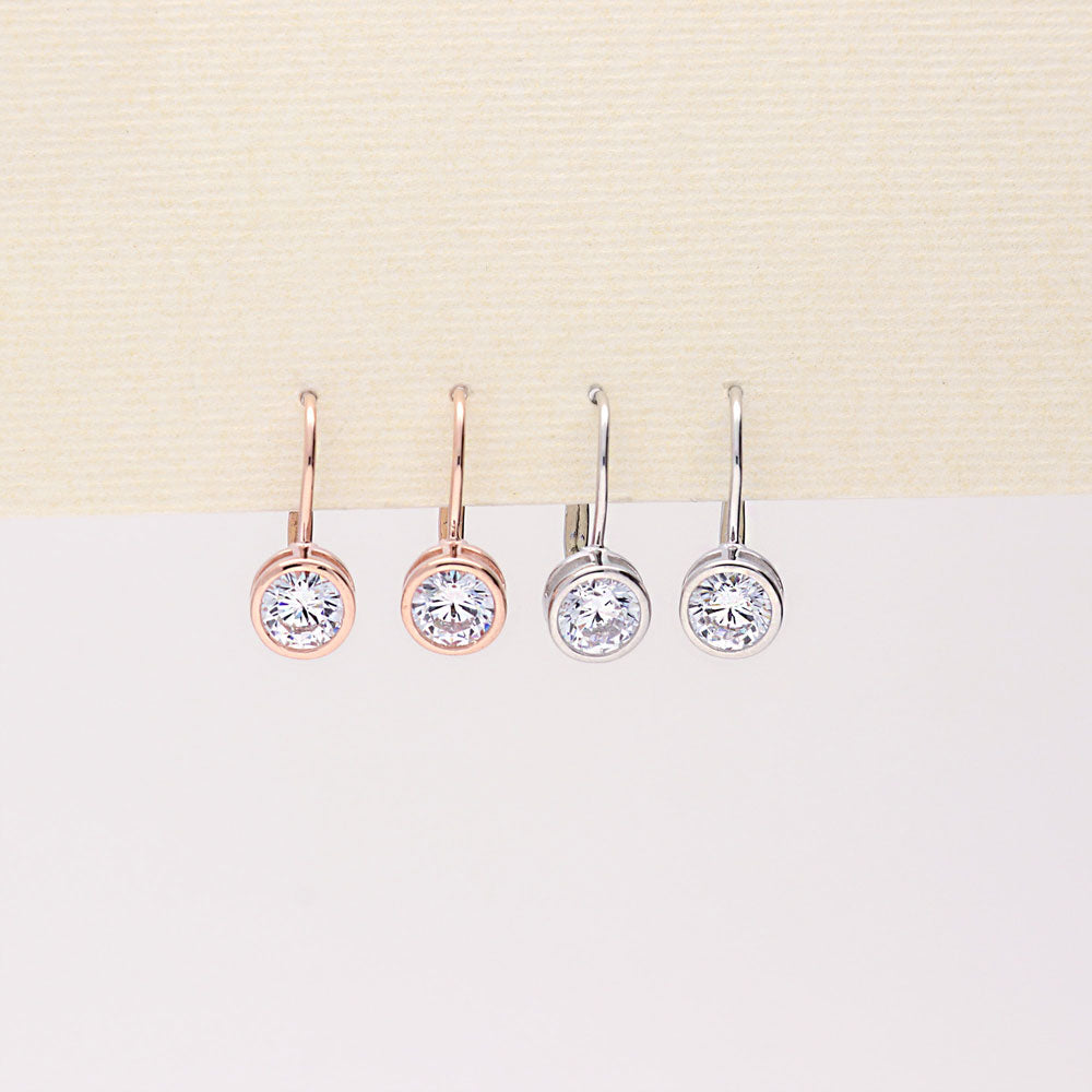 Flatlay view of Solitaire 2.4ct Bezel Set Round CZ Earrings in Sterling Silver, 2 Pairs