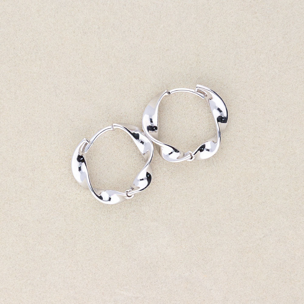 Flatlay view of Woven Medium Hoop Earrings in Sterling Silver 0.63 inch