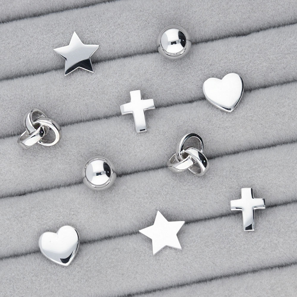 Flatlay view of Love Knot Stud Earrings in Sterling Silver