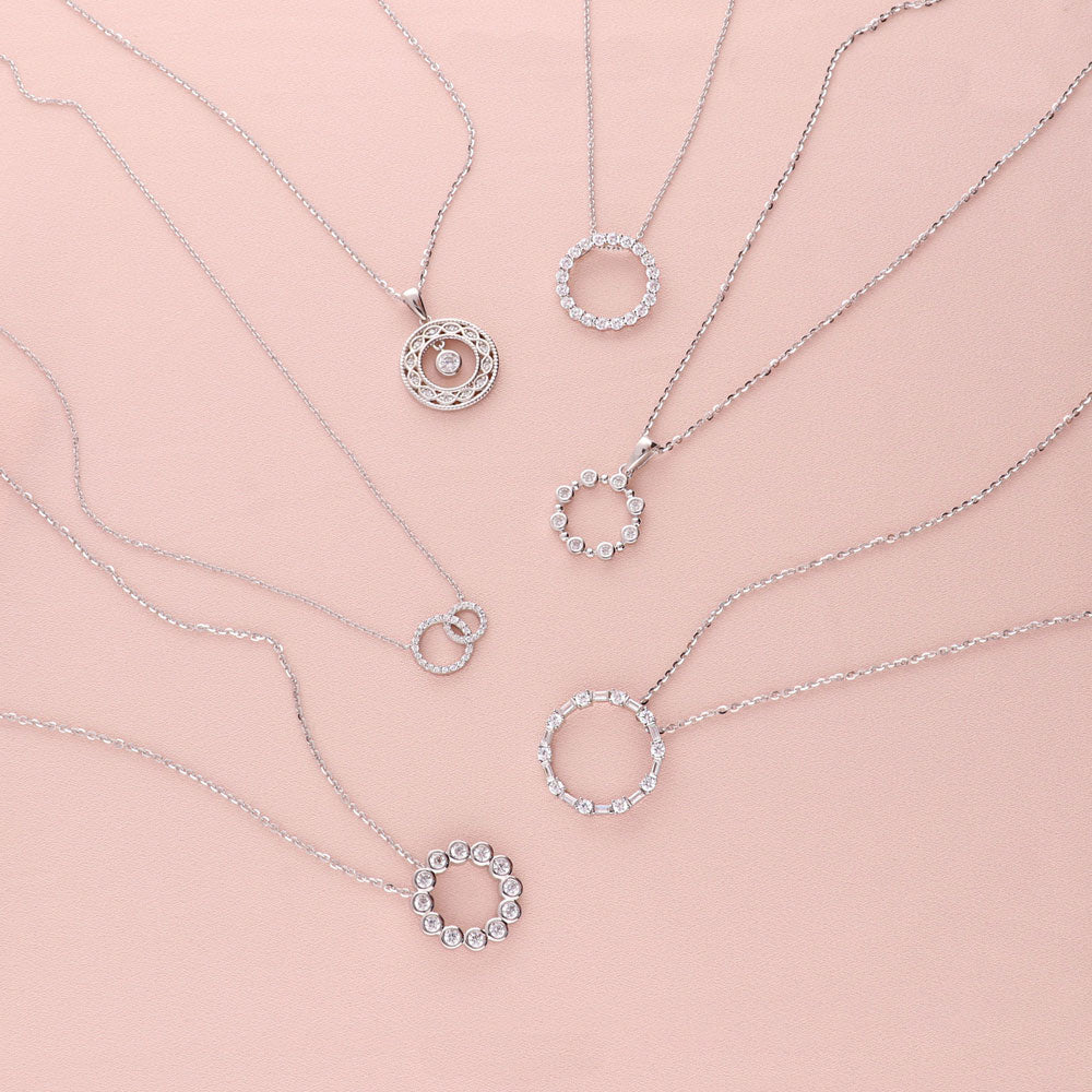 Flatlay view of Bubble Open Circle CZ Pendant Necklace in Sterling Silver