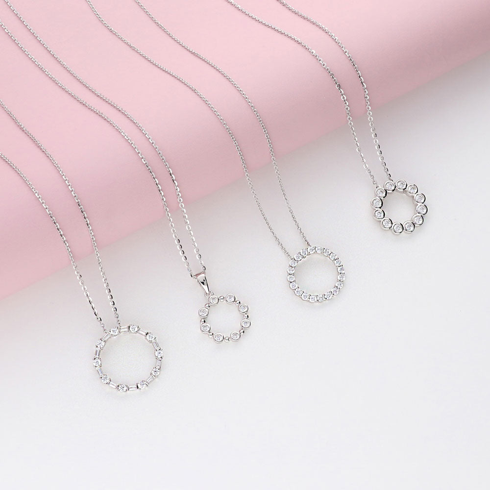 Flatlay view of Open Circle CZ Necklace and Earrings Set in Sterling Silver