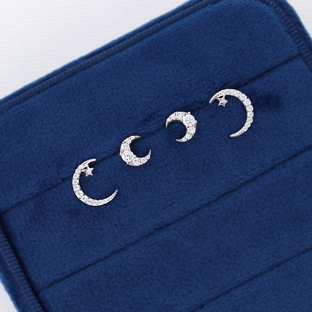 Flatlay view of Star Crescent Moon CZ Stud Earrings in Sterling Silver