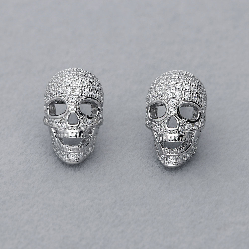 Flatlay view of Skull Bones CZ Stud Earrings in Sterling Silver
