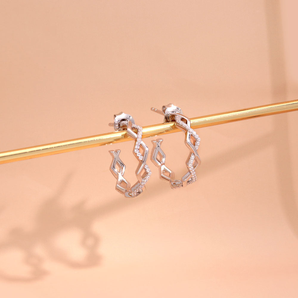 Flatlay view of Woven CZ Medium Half Hoop Earrings in Sterling Silver 0.8 inch