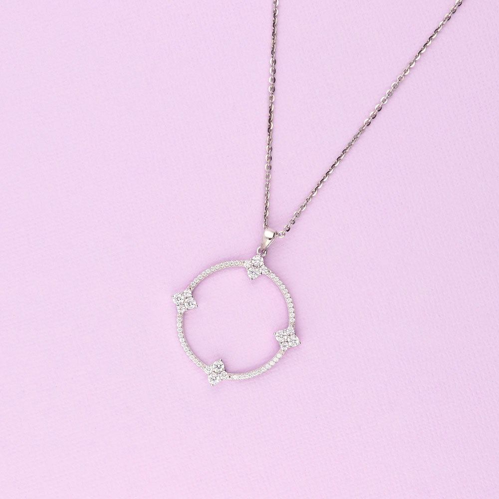 Flatlay view of Open Circle Flower CZ Pendant Necklace in Sterling Silver