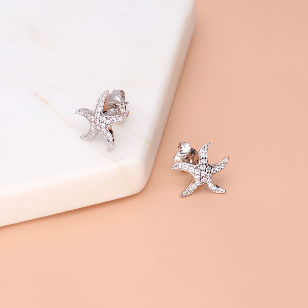 Flatlay view of Starfish CZ Stud Earrings in Sterling Silver