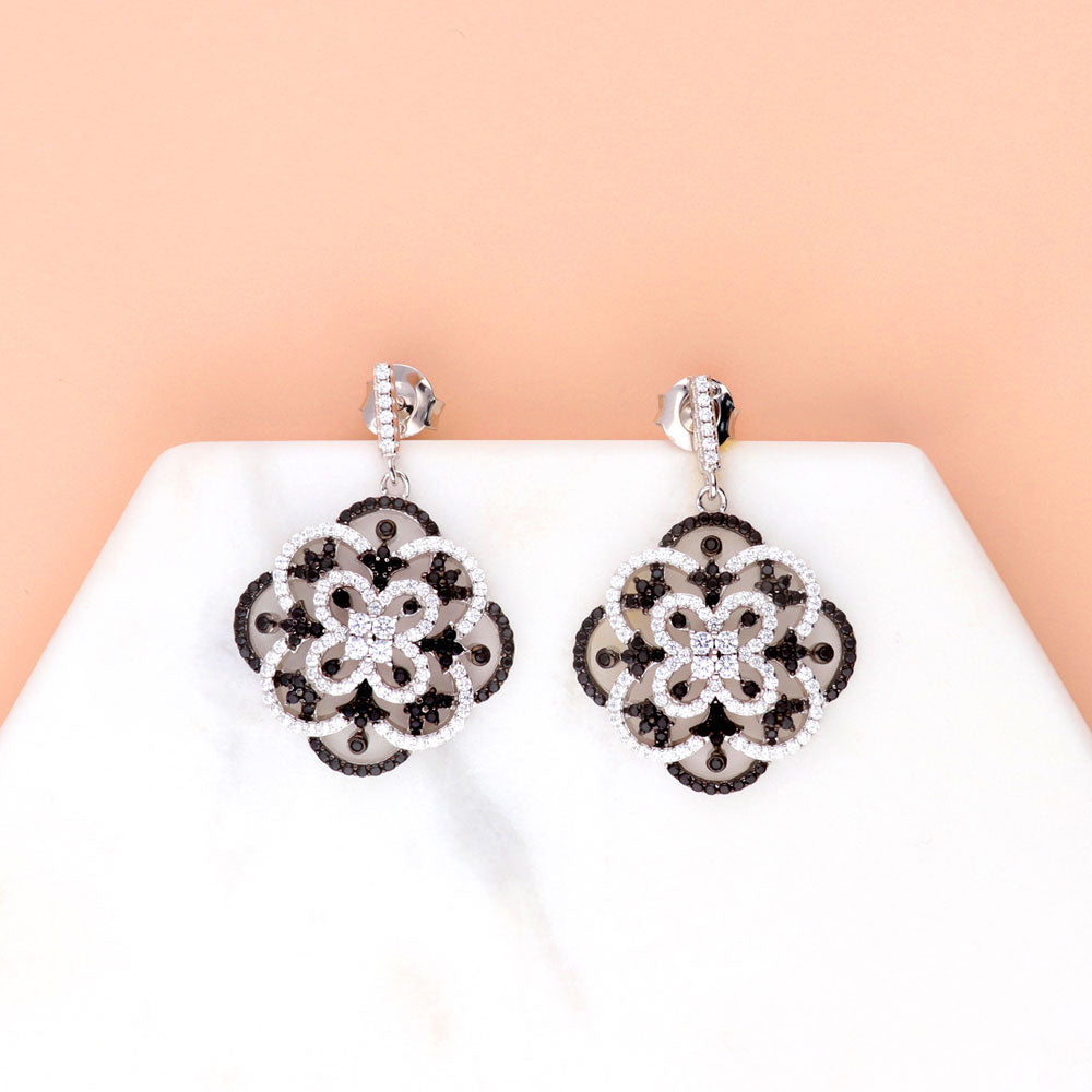 Flatlay view of Flower Black and White CZ Statement Dangle Earrings in Sterling Silver, 5 of 7