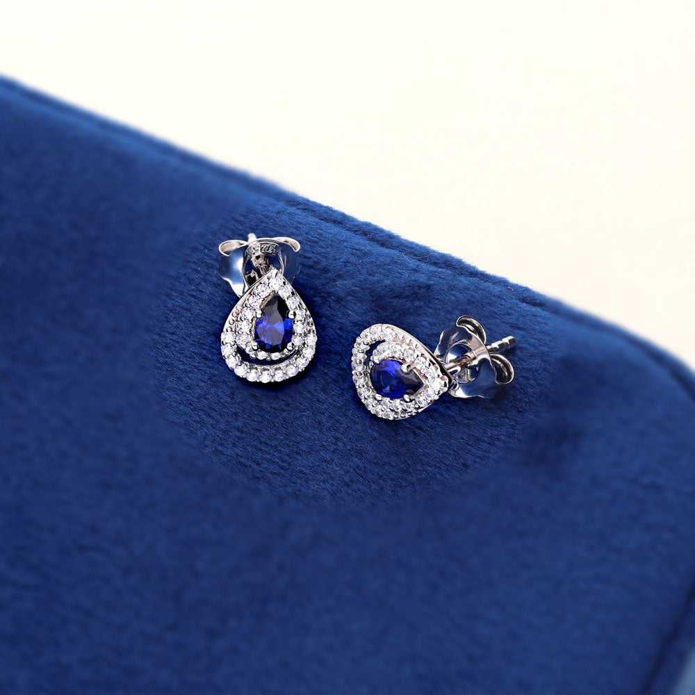 Flatlay view of Teardrop Simulated Blue Sapphire CZ Stud Earrings in Sterling Silver, 4 of 7