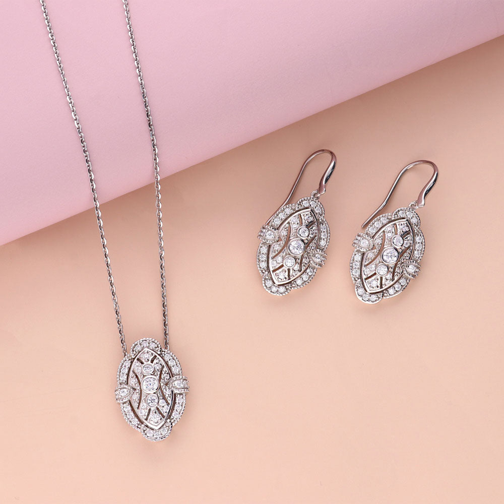 Flatlay view of Art Deco Milgrain CZ Necklace and Earrings Set in Sterling Silver