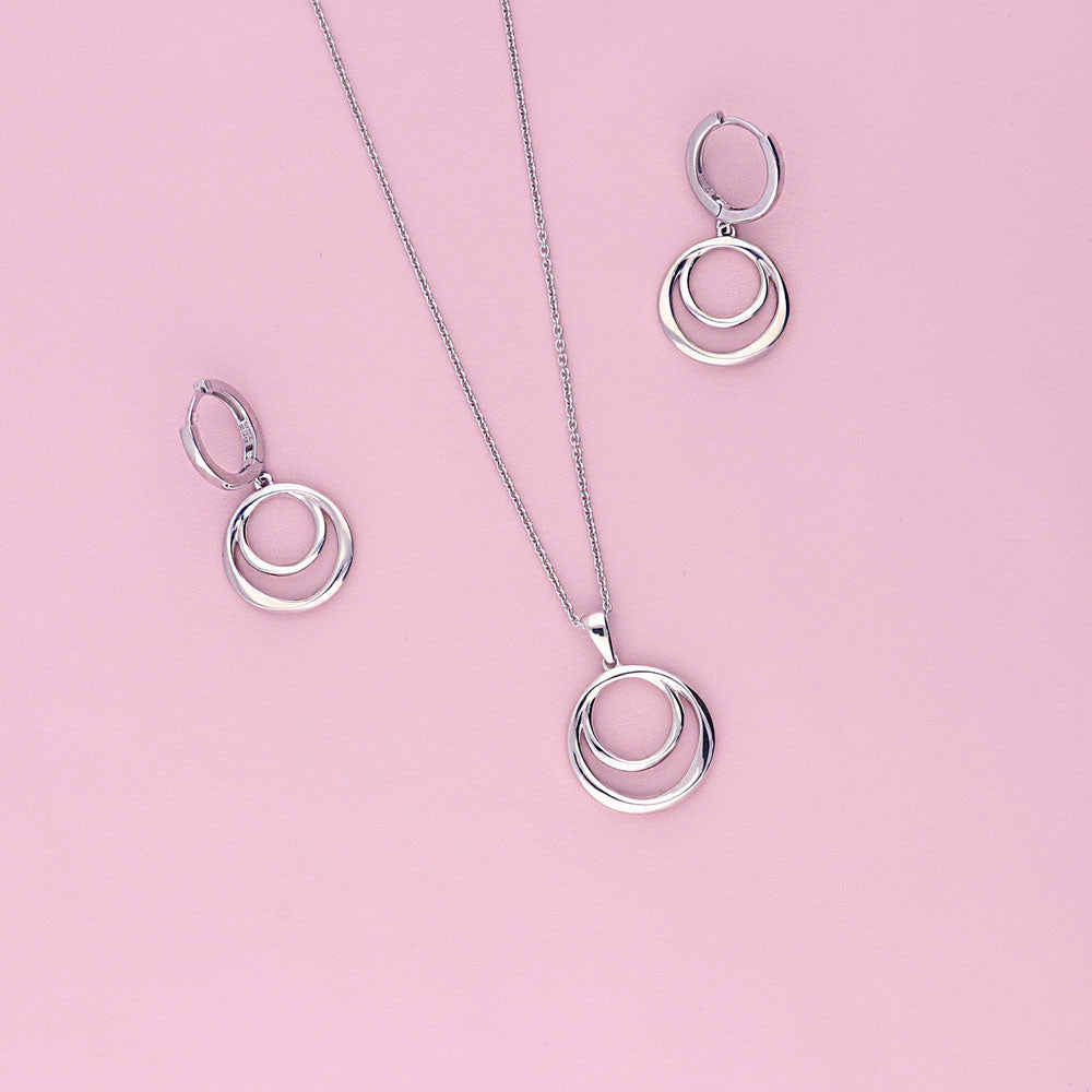 Flatlay view of Open Circle Dangle Earrings in Sterling Silver