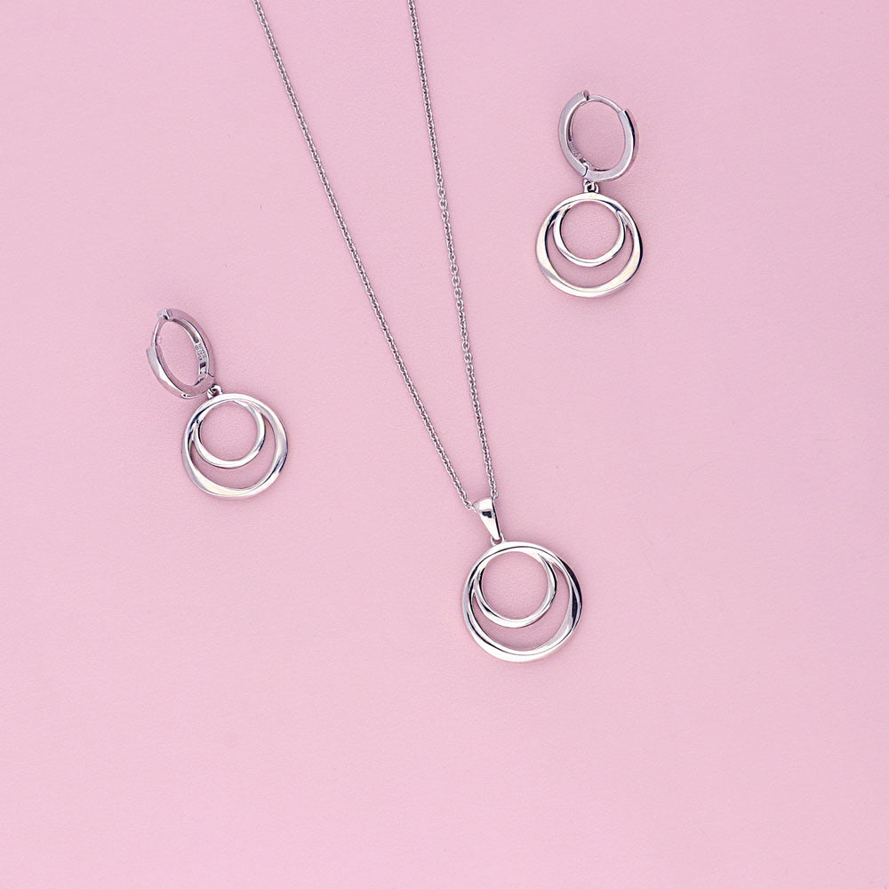 Flatlay view of Open Circle Necklace and Earrings Set in Sterling Silver