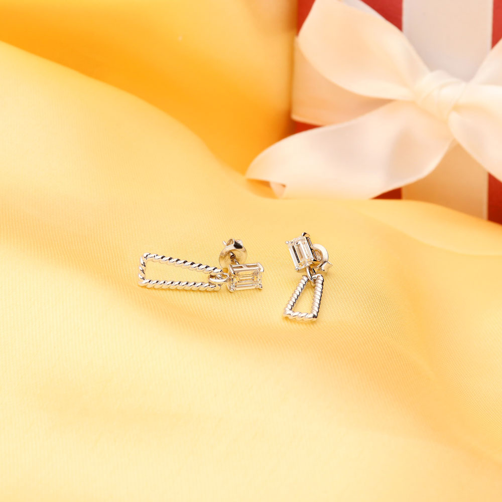 Flatlay view of Cable Trapezoid CZ Dangle Earrings in Sterling Silver