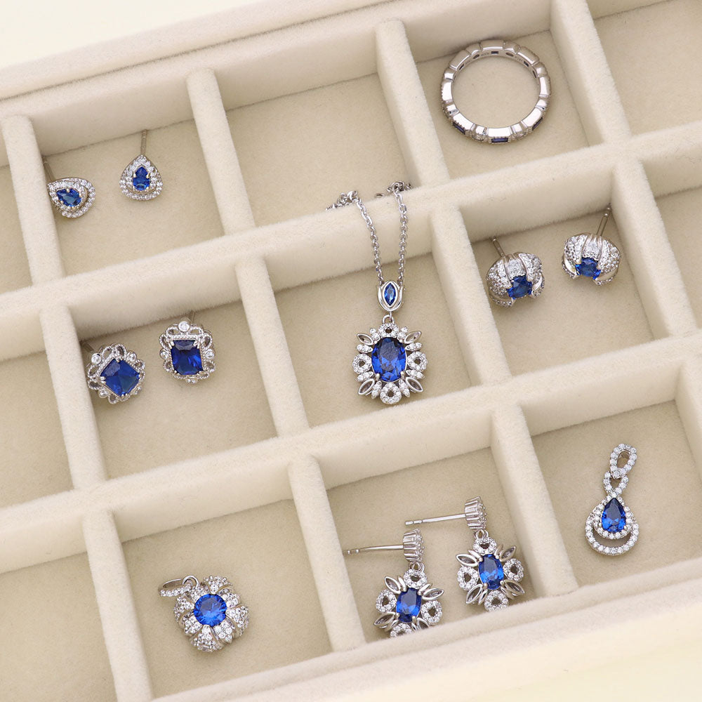 Flatlay view of Art Deco Simulated Blue Sapphire CZ Stud Earrings in Sterling Silver